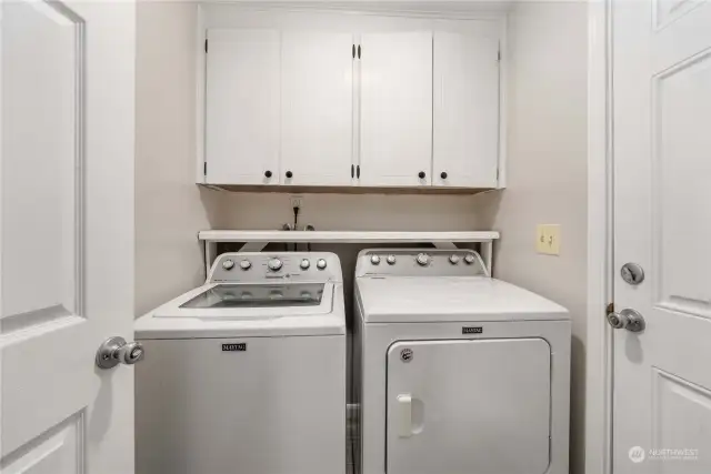 The laundry room has added storage AND the light auto-turns on when you enter the room for hands-free lighting.