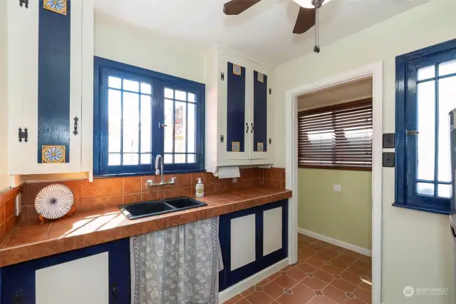 Kitchen flows into a nice sized laundry room with additional cabinet space!