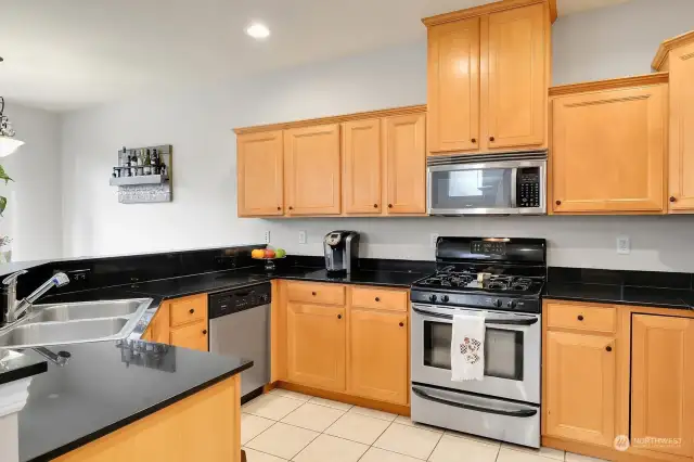 Granite countertops, stainless steel appliances, and ample cabinet space.