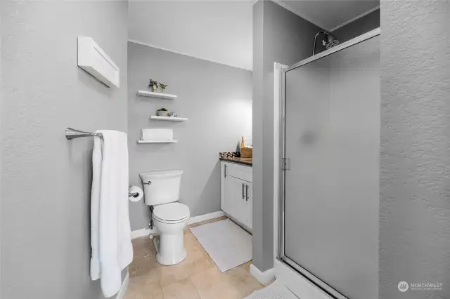 Primary bathroom with tile flooring