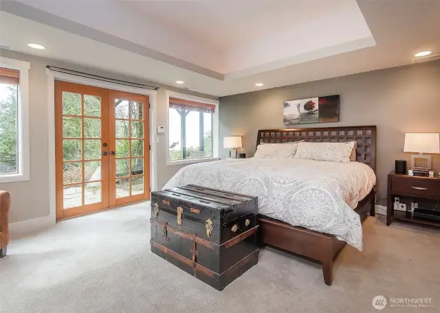 Primary bedroom with a view of the Puget Sound and Olympic Mountains.