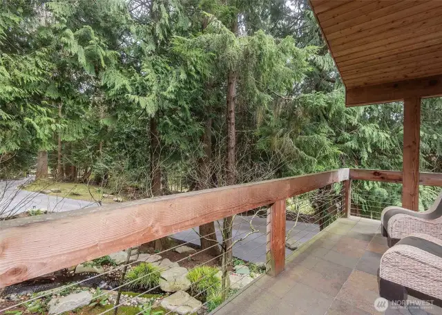 View toward the front gate of the home and another deck available to enjoy this gorgeous property.