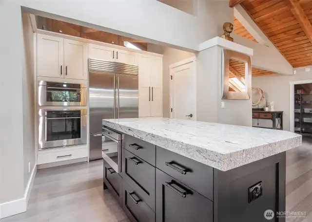 Well appointed island kitchen with Wolf and Sub Zero appliances.