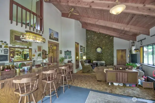 Huge family room with stone fireplace