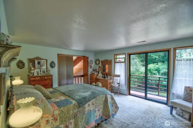 Primary Bedroom private balcony and peek-a-boo doors above wet bar