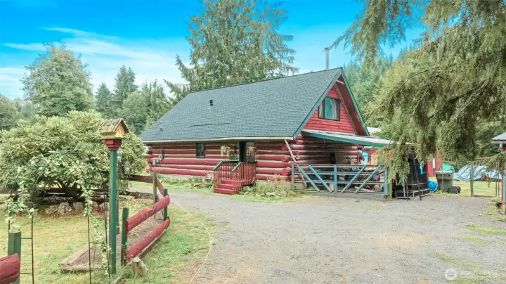 On a quarter-acre cul-de-sac lot in River N Forest, you’ll find multiple outbuildings—including a children’s cabin, saloon-style shed, storage, and wood shed—plus room to grow vegetables in a peaceful, private setting.