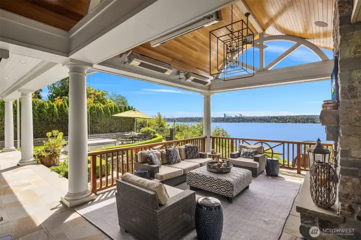 This covered and heated deck provides the perfect outdoor living space framing the waterfront beautifully.