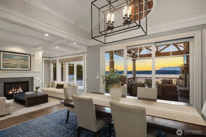 This communication between this dining area and the covered outdoor room is just sublime.  The owners say this is the heart of the home that everyone loves! Enjoy walls of glass or the great outdoors for your symphony of year round color .