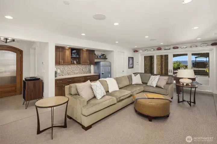 Downstairs, the entertainment level delivers year-round delight.