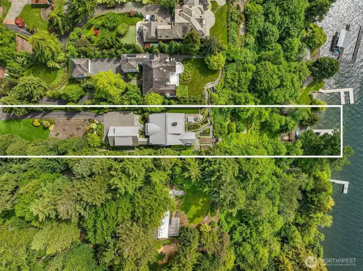 This street-to-water estate spans over an acre across two tax parcels, offering rare privacy and a lifestyle beyond compare.