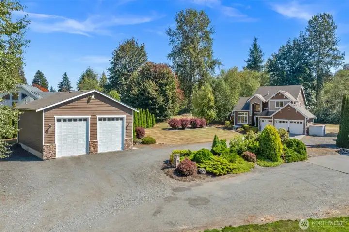 2.95 acres with 36x36 shop at front of driveway leading to beautiful home