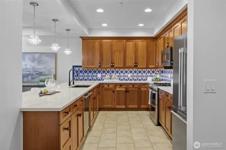 Enjoy generous prep space and sleek storage solutions in this modern kitchen