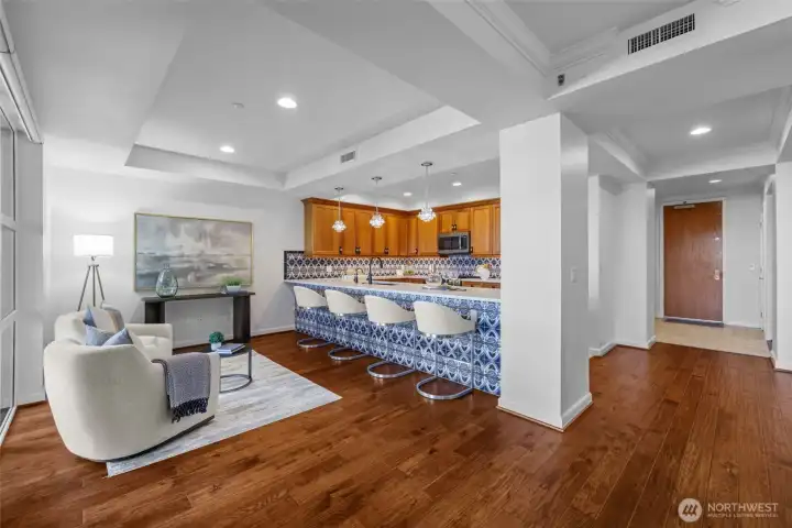 Open-concept living designed for effortless entertaining and everyday comfort. Elegant coffered ceilings elevate the room with classic character and depth.