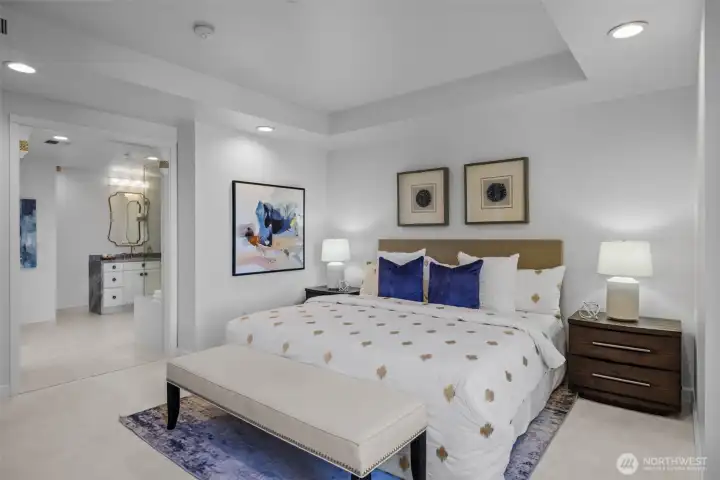 Relax in your serene primary suite, outfitted with California Closets and motorized Hunter Douglas blinds.