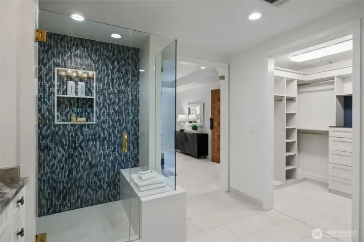 Step into luxury with this elegant tile shower featuring sleek modern fixtures