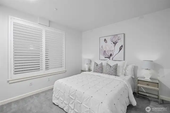 Bedroom #2 features charming custom shutters that add style and privacy.