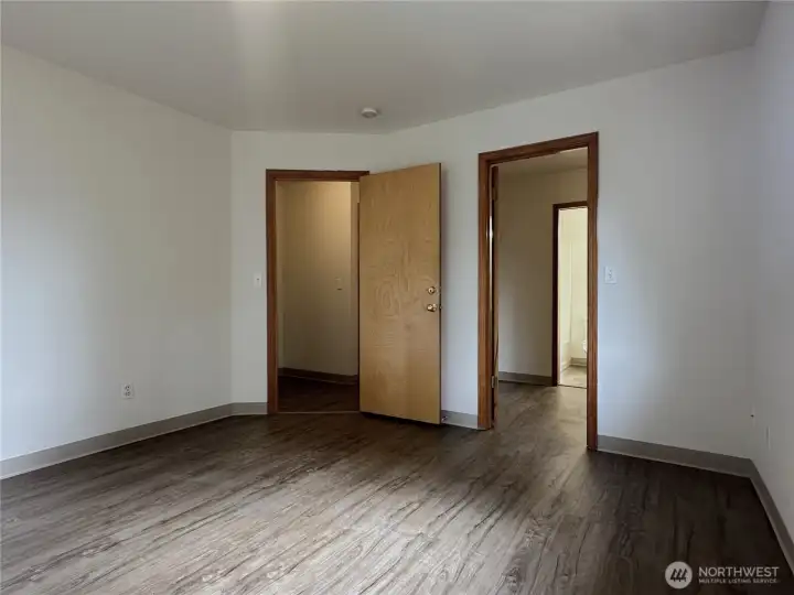 Primary Bedroom with Door to Closet and Attached Bathroom