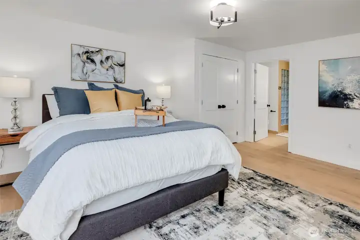 Primary Bedroom Retreat: Unwind in your serene owner’s suite featuring soft tones, plush textures, and peaceful garden views.