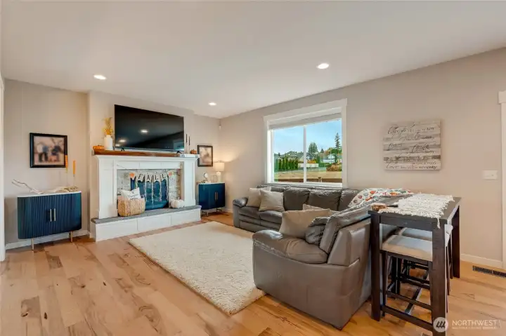 Seamlessly flowing to open great room w/gas fireplace...