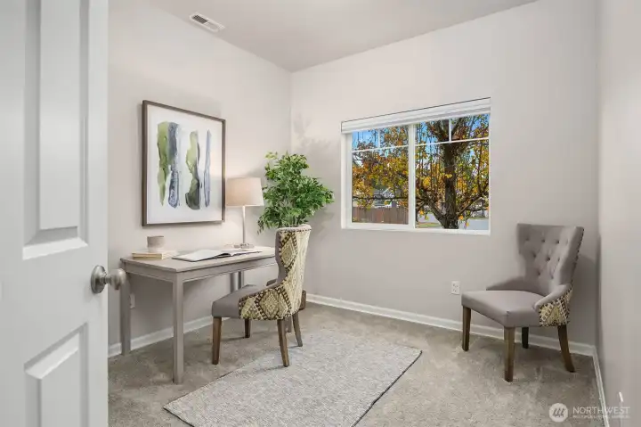 Main floor bedroom or ideal office space!