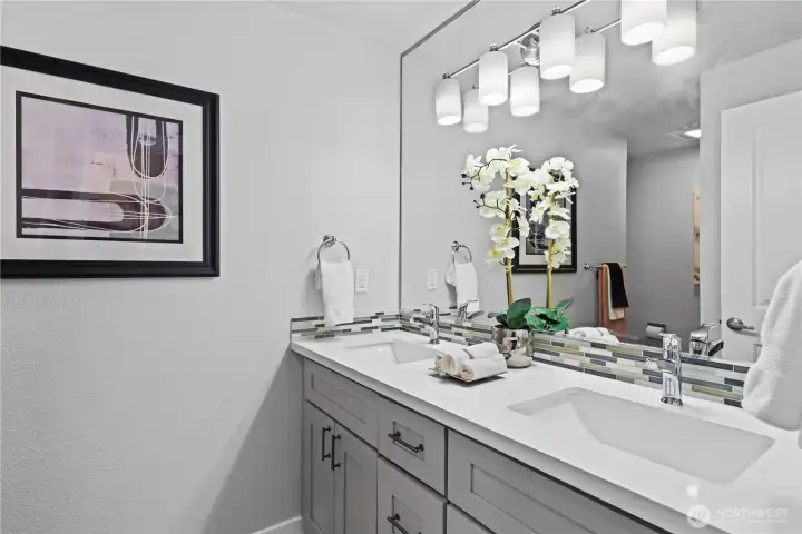 Bedrooms 2 & 3 share this full bath with double vanity