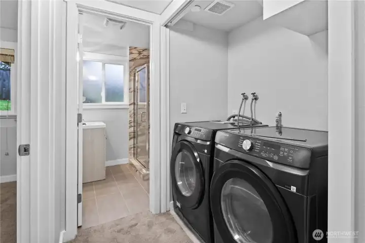 Laundry in the hall between bedroom & bath