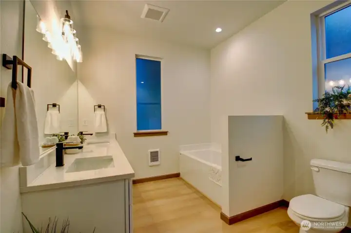 Primary Bathroom has separate tub and shower.