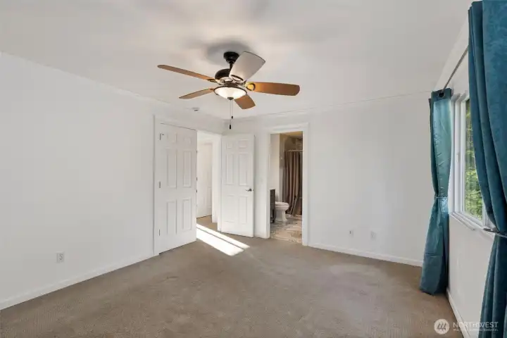 French doors lead to the hallway from the primary bedroom