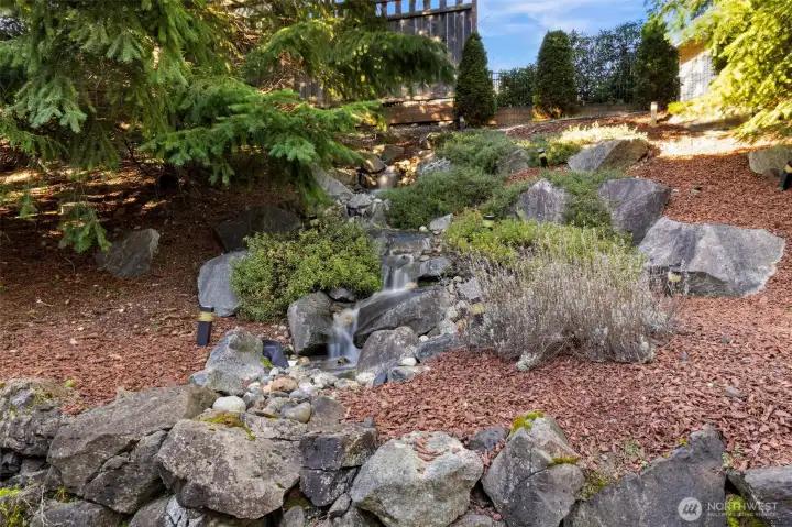 Peaceful fountain in backyard provides a soothing backdrop