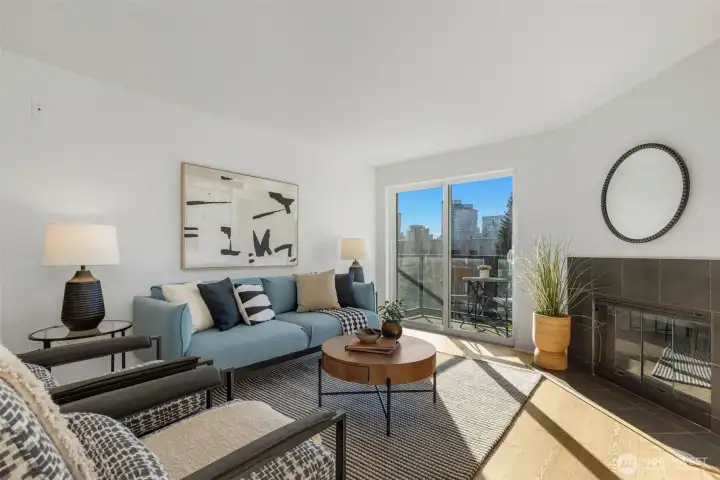 Light and bright living room. New floors and paint! Cute fireplace keeps you cozy.