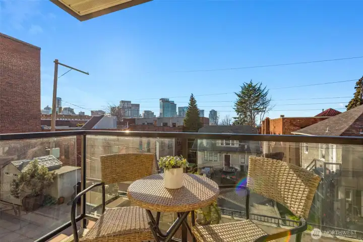 Deck off living room with city and Space Needle views.