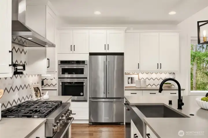 Chef's kitchen with stainless steel appliances
