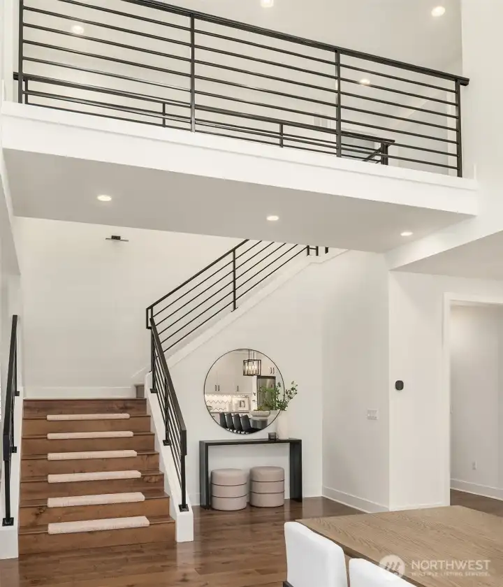 Bridge connecting Primary to the left and upper floor bedrooms on the right