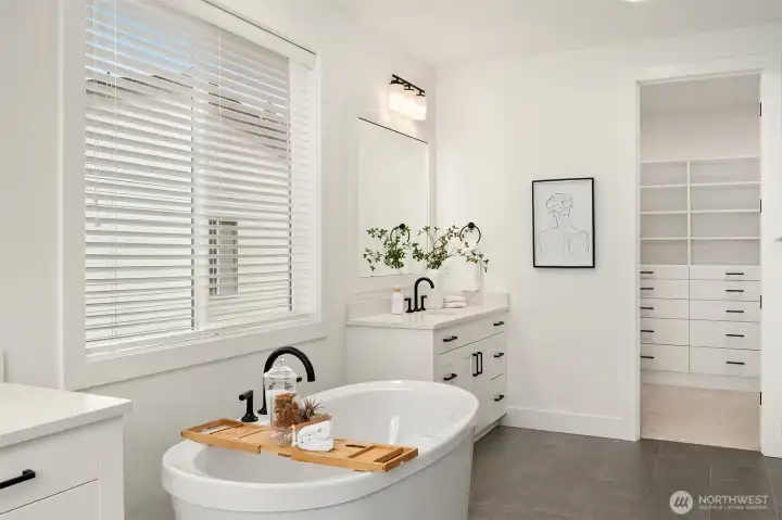 Primary bathroom and spacious dual closet