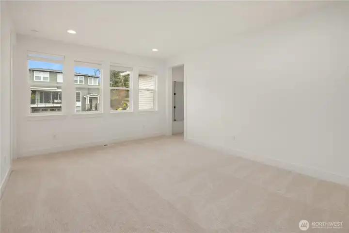 Sitting area with one bedroom to the left and two bedrooms on the right