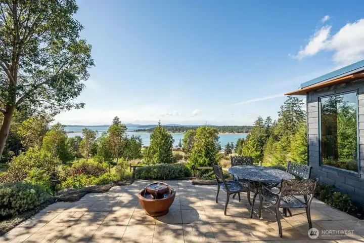 The west-facing patio, accessed from the living area, with stunning, panoramic views of the water and distant islands.