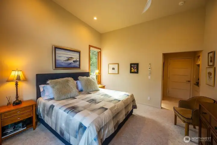 Second en suite bedroom on main floor has a sitting area, a coffee/tea cubby, closet, and its own 3/4 bathroom.