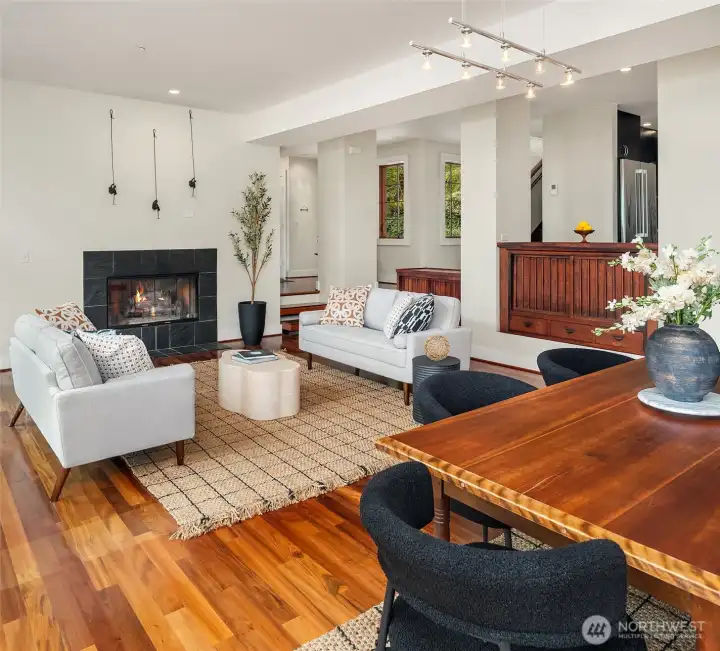 Custom wood built-ins for storage are accessed from the living room and complement the tigerwood floors.