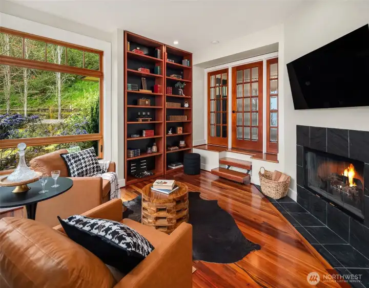 The flex room has custom wood built-in bookshelves, ready for your tomes. A beautiful room with views of your gardens from the south window and Mt. Rainier from the east window.