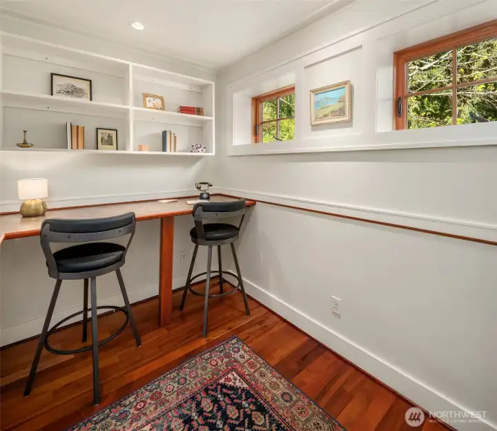 This picture does not do the office justice. There is an L-shaped counter for all of your technology plus multiples built-in shelves in the photo as well on the wall that is not pictured. The office is off the kitchen which is all on the main level of the home.