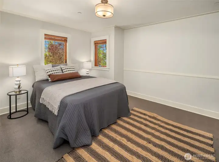 The second biggest bedroom on the second floor has a large closet as well as a built-in desk and bookshelves.