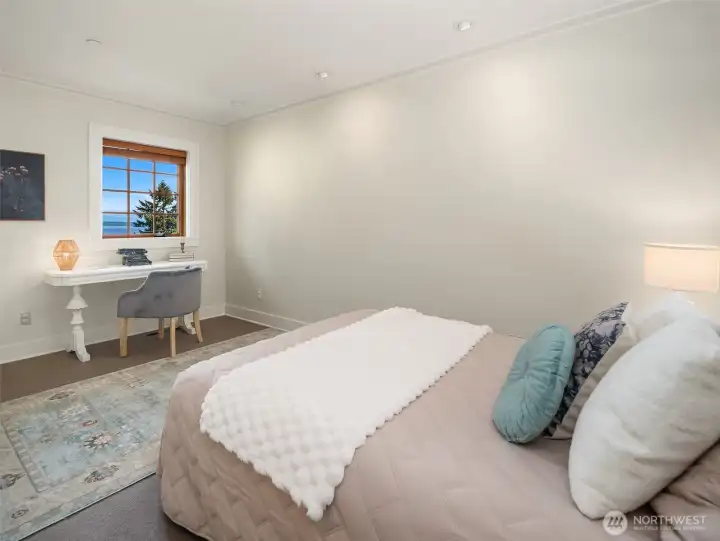 The third bedroom, on the second floor, has the smallest footprint out of all of the bedrooms but has a great view of Mt Rainier. It is located next to the primary so could be turned into a great second office if needed, or even a work-out room.