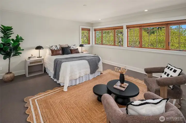 The opulent, en suite, primary features 2 walk-in closets and a splendid bathroom with walk-in shower.