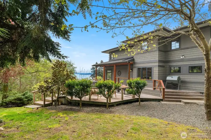 The north side of the home boasts a generous deck along with a newer hot tub. A lovely spot to relax year-round.