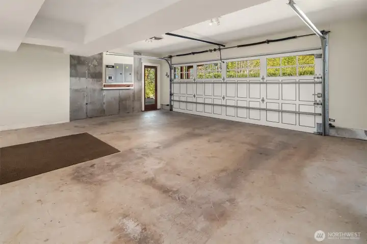 The 2-car garage has workshop space as well as access to the bonus room.