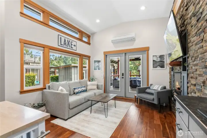 Large windows and natural finishes create a warm, inviting atmosphere Large windows and natural finishes create a warm, inviting atmosphere