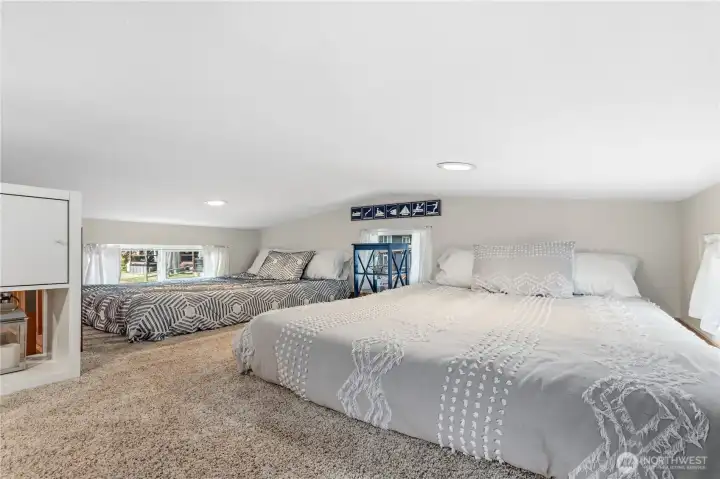 Loft area offering flexible space for guests, recreation, or additional sleeping arrangements. Loft area offering flexible space for guests, recreation, or additional sleeping arrangements.