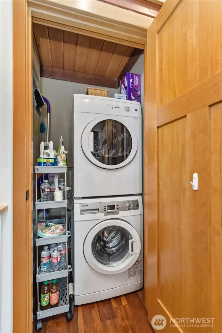 Stacked washer and dryer tucked into dedicated laundry space for everyday convenience. Stacked washer and dryer tucked into dedicated laundry space for everyday convenience.