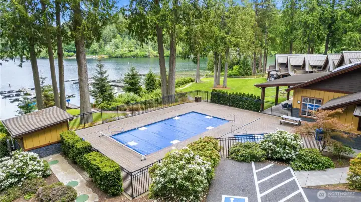 Resort-style pool area offers additional space to relax and enjoy sunny days near the waterfront. Resort-style pool area offers additional space to relax and enjoy sunny days near the waterfront.