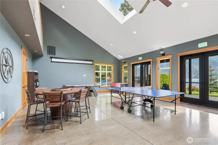 Spacious recreation room offers flexible community space for games, gatherings, and entertaining with views toward the water. Spacious recreation room offers flexible community space for games, gatherings, and entertaining with views toward the water.